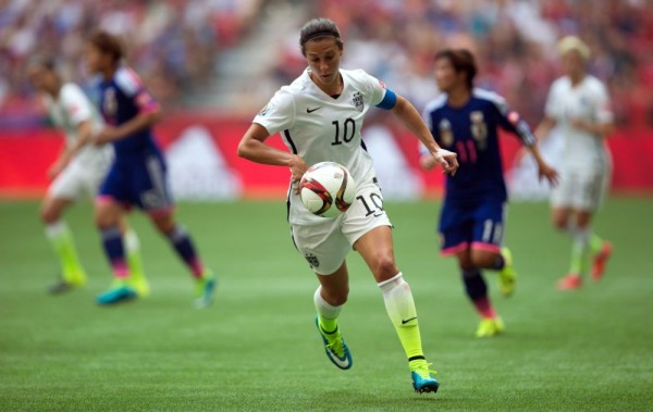 United States' Carli Lloyd (10) chases down the ball during the first half of the FIFA Women's World Cup soccer championship against Japan in Vancouver, British Columbia, Canada, on Sunday, July 5, 2015. (Darryl Dyck/The Canadian Press via AP) MANDATORY CREDIT