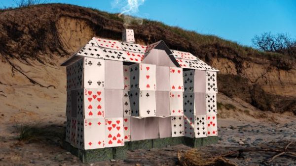 House of cards on the edge of water